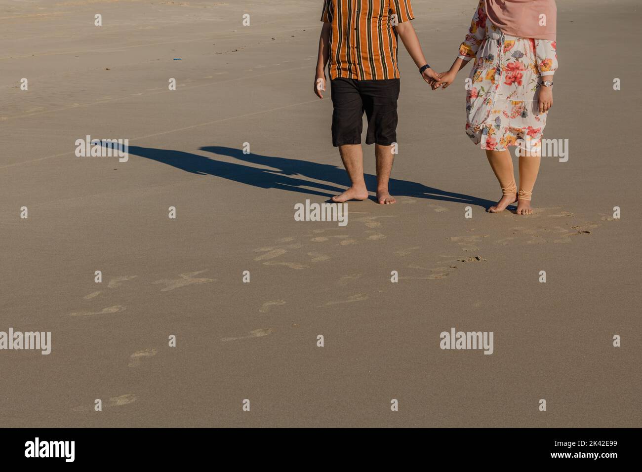 Back view young family walking hi-res stock photography and images - Alamy