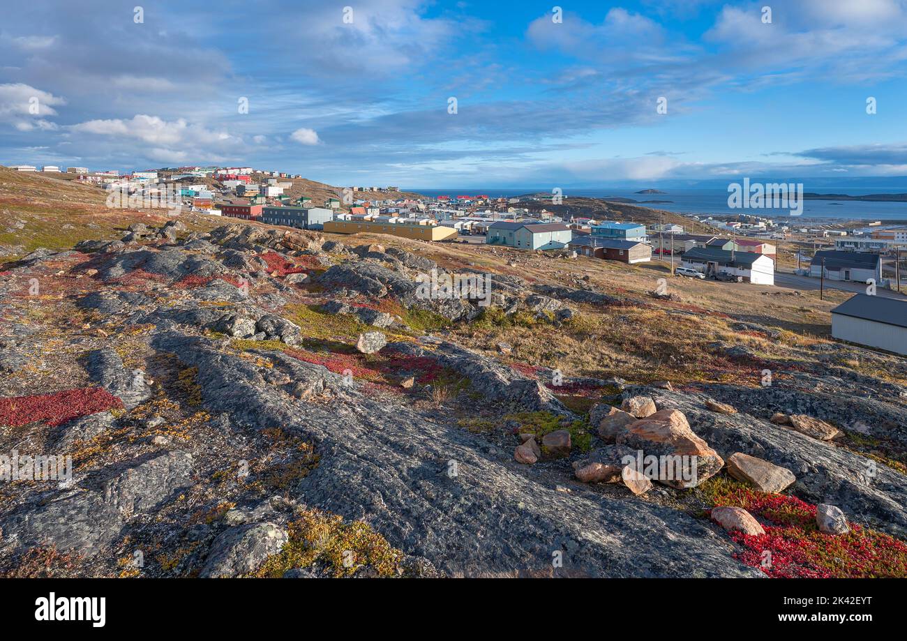 Overview of the city of Iqaluit with the Arctic Ocean harbor in the distance Stock Photo