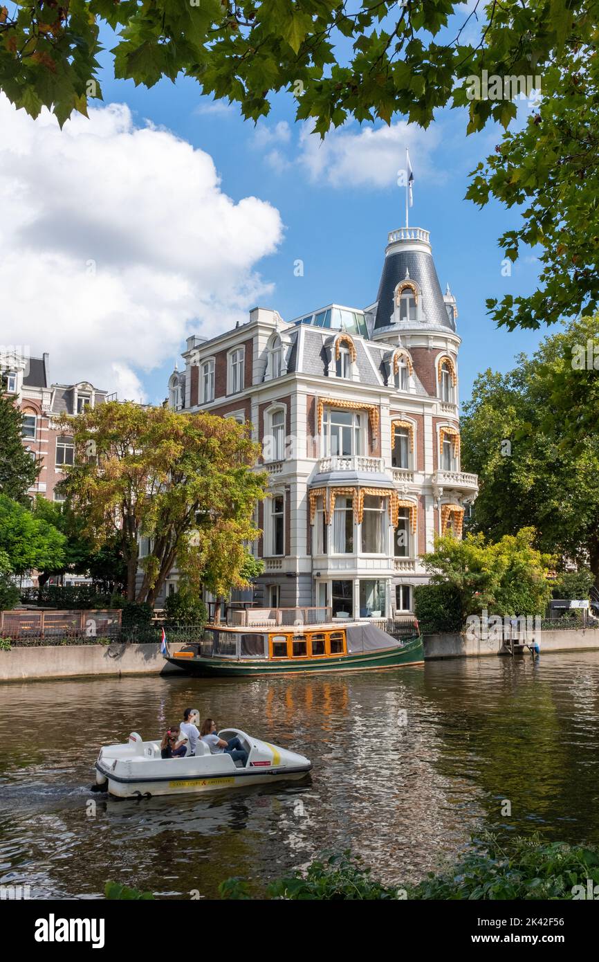 Pedal Boat and Atlas Tax Law Firm - Picturesque building near Rijksmuseum, Amsterdam, The Netherlands Stock Photo