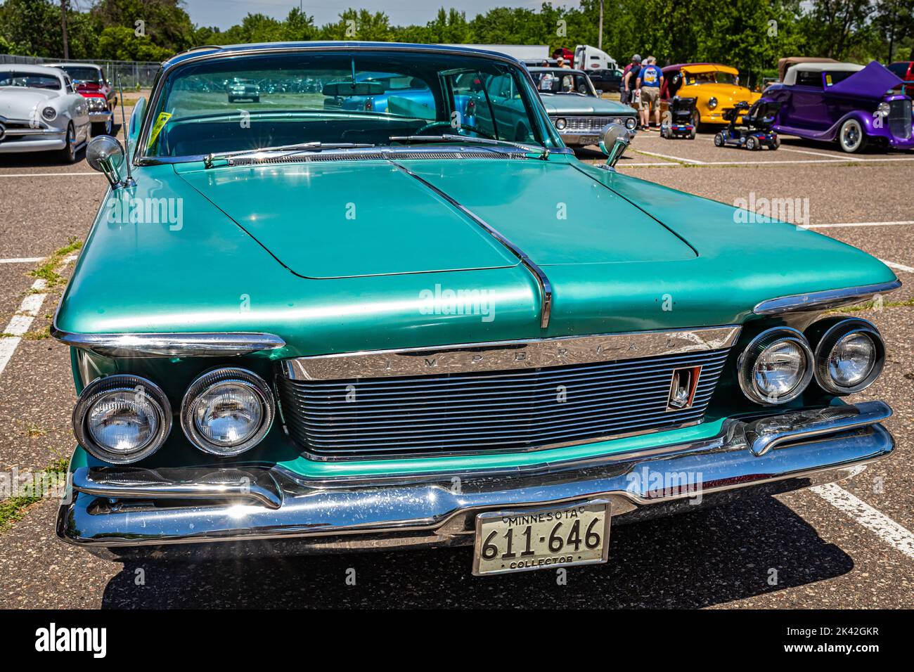 Falcon Heights, MN - June 18, 2022: Wide angle high perspective front view of a 1961 Chrysler Imperial Crown 4 Door Hardtop at a local car show. Stock Photo