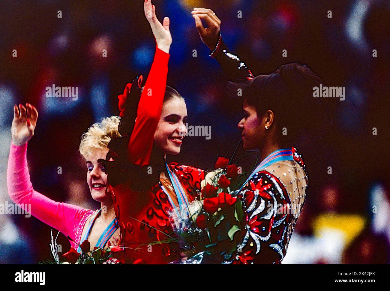 Katarina Witt (GDR) Gold medalist and Olympic Champion with Elizabeth Manley (CAN)-L- silver medalist and bronze medalist Debi Thomas (USA) in the Ladies Figure Skating at the 1988 Olympic Winter Games. Stock Photo