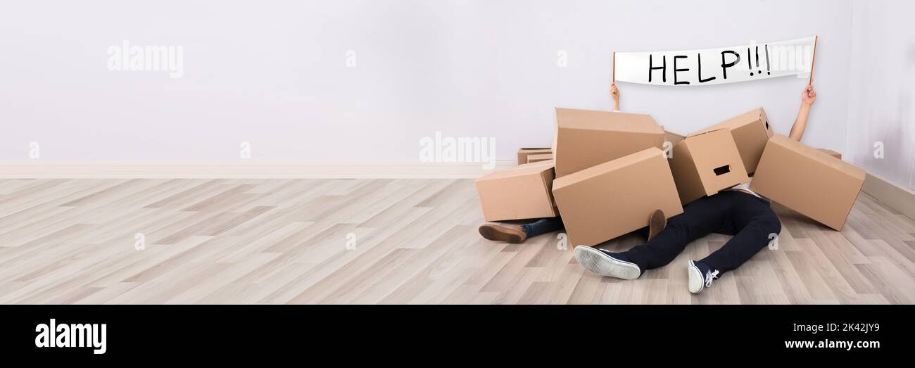 Funny Couple After Accident Under Moving Cardboard Boxes Stock Photo