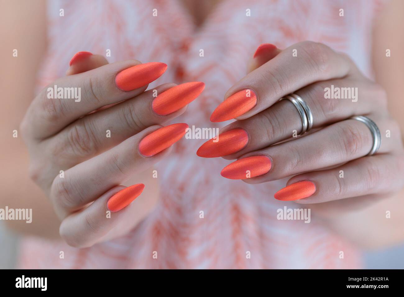 Woman coral nail polish hi-res stock photography and images - Alamy
