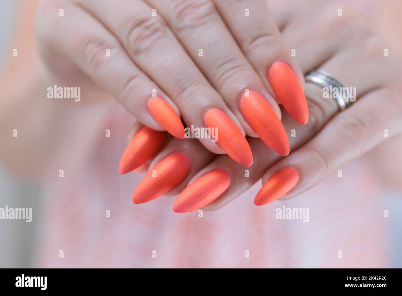 Woman coral nails hi-res stock photography and images - Alamy