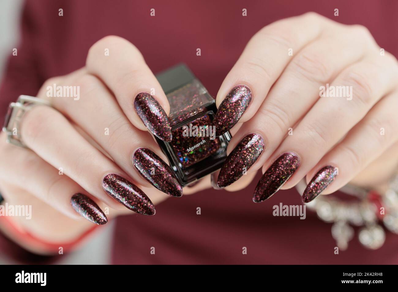 Woman Hand with Long Nails and a Bottle of Dark Red Nail Polish Stock Image  - Image of brand, acrylic: 268253391