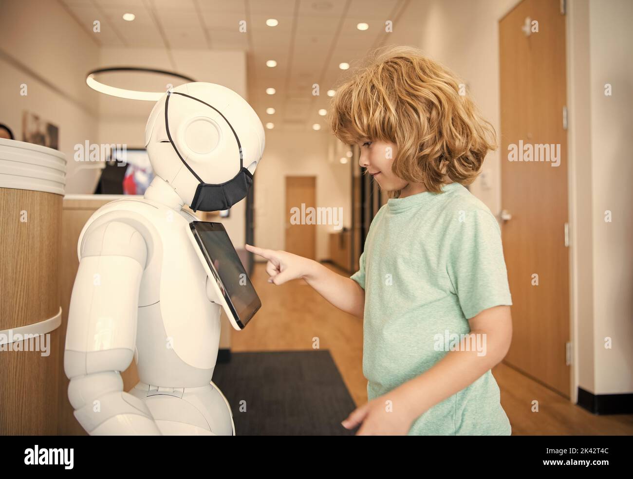 child-interact-with-cyborg-artificial-intelligence-communication-stock