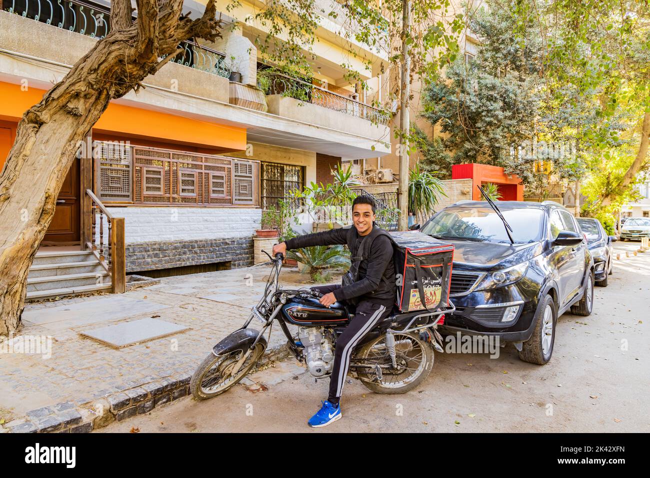 Cairo, Egypt. February 11, 2022. Food delivery driver on a motorcycle in Cairo Stock Photo Alamy