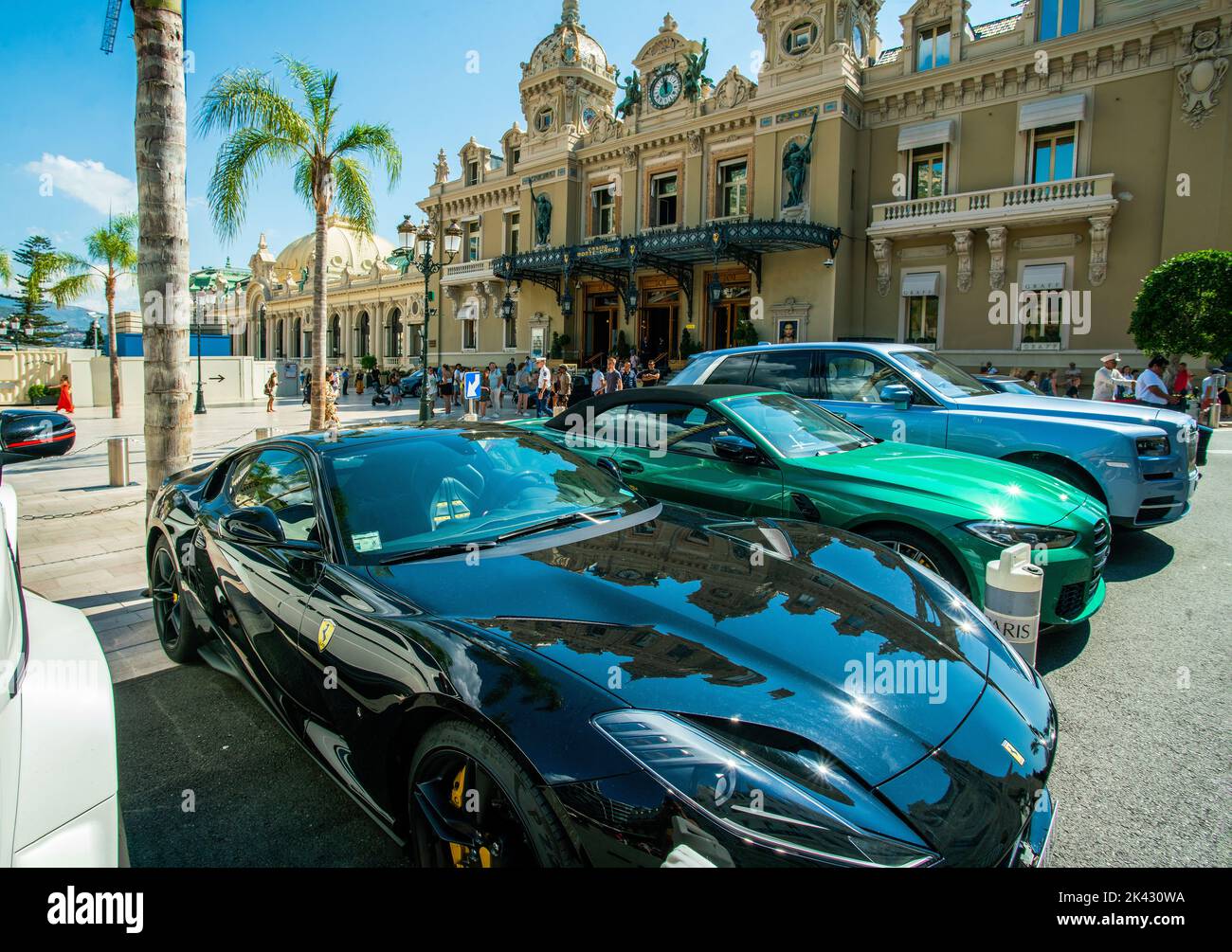 Sports cars (coupe) in Monaco next to the famous Monte Carlo casino and