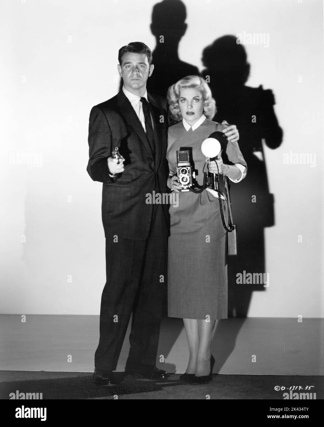 RICHARD CRENNA and CLEO MOORE posed publicity portrait in OVER-EXPOSED 1956 director LEWIS SEILER gowns Jean Louis Columbia Pictures Stock Photo