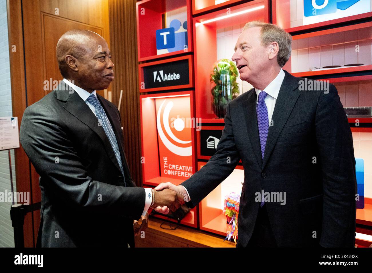 New York City Mayor Eric Adams (D) shaking hands with Microsoft