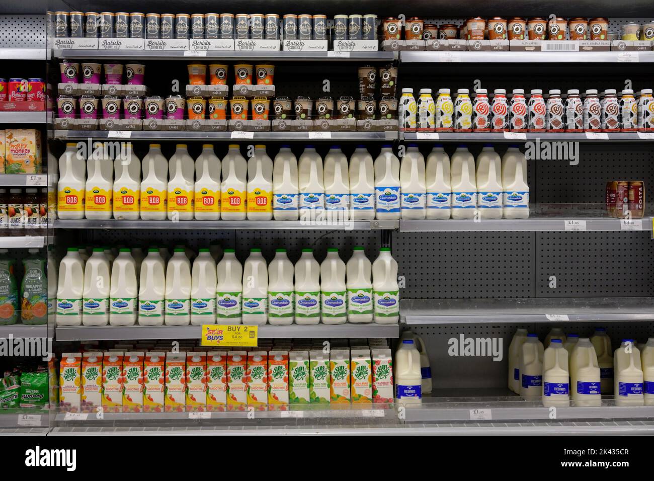 Home Bargains discount store shelves with milk and drinks, UK Stock Photo