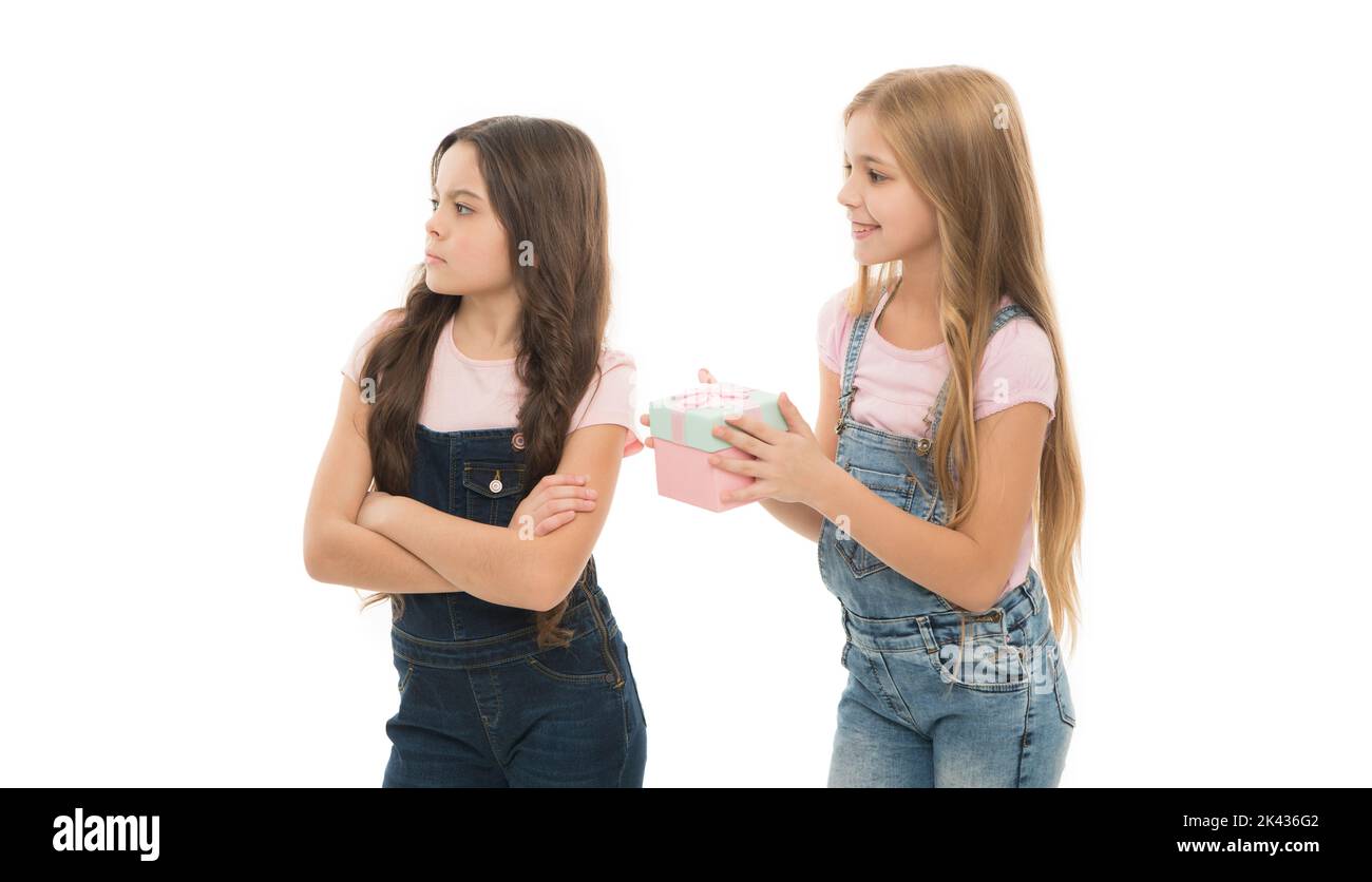 Celebrating friendship. Early childhood friends. Little girl giving present to her friend. Friendship concept. Bonds of friendship or family ties Stock Photo