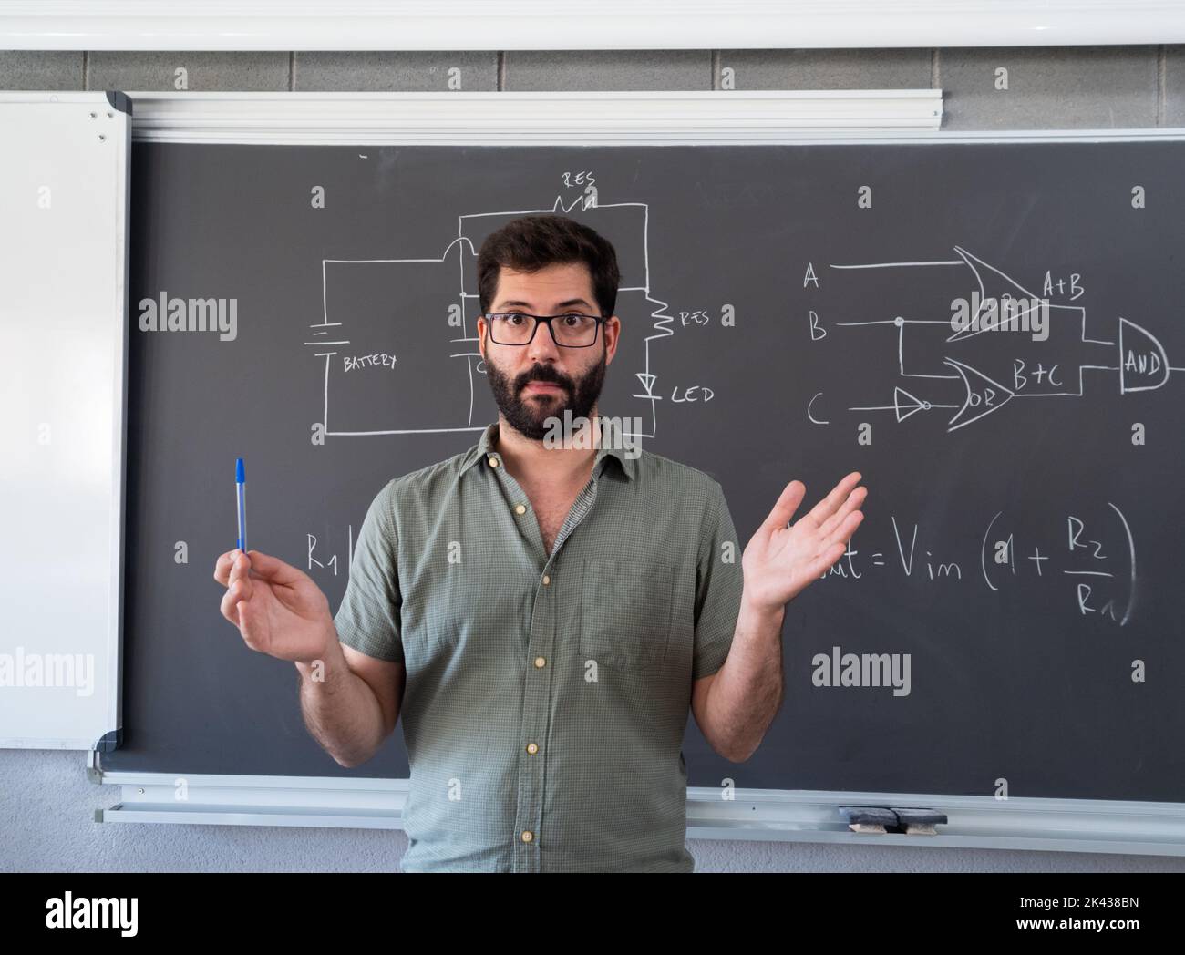 Spanish male teacher explaining the science lesson Stock Photo Alamy