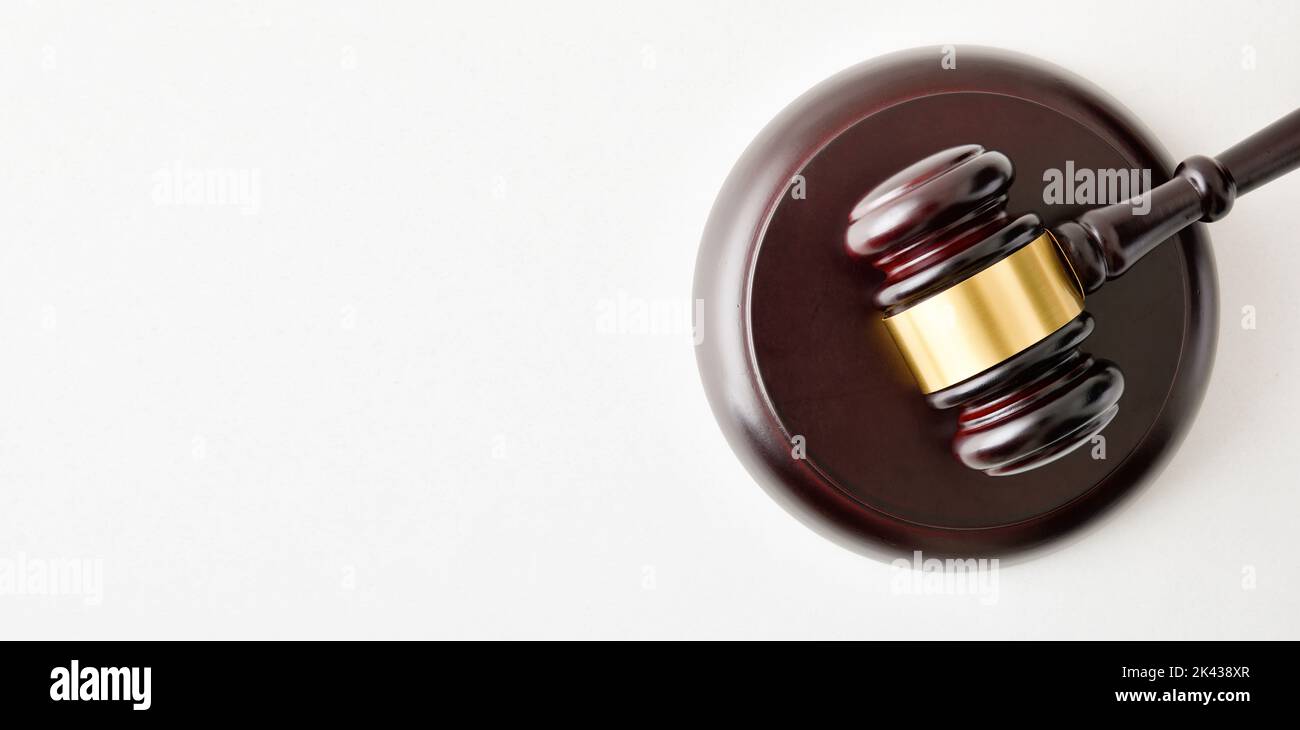 Background of judge's mace on white table and white isolated background. Top view Stock Photo