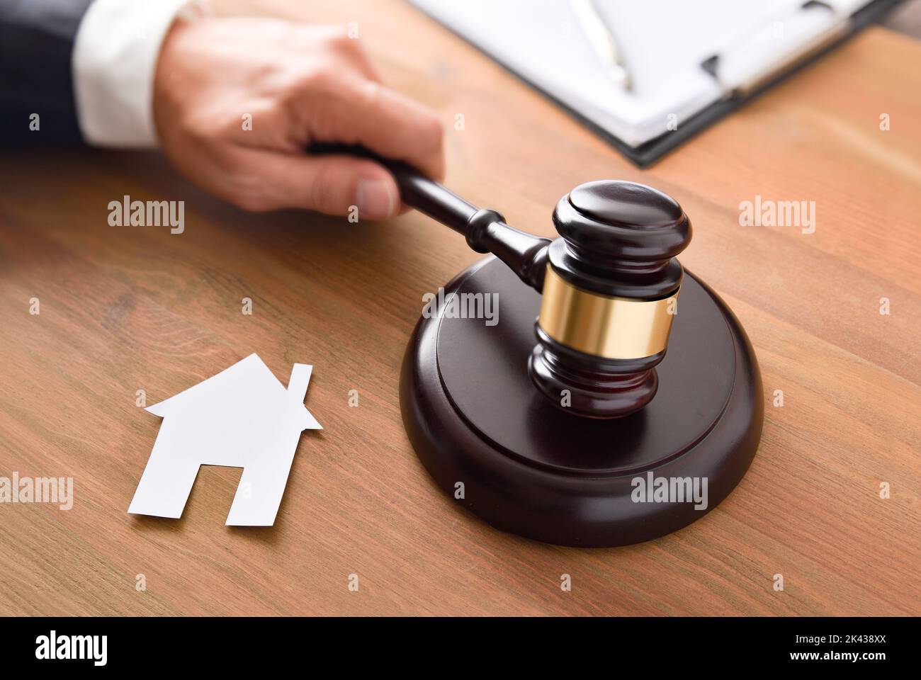 Housing reference judgment concept with judge beating with a gavel and
