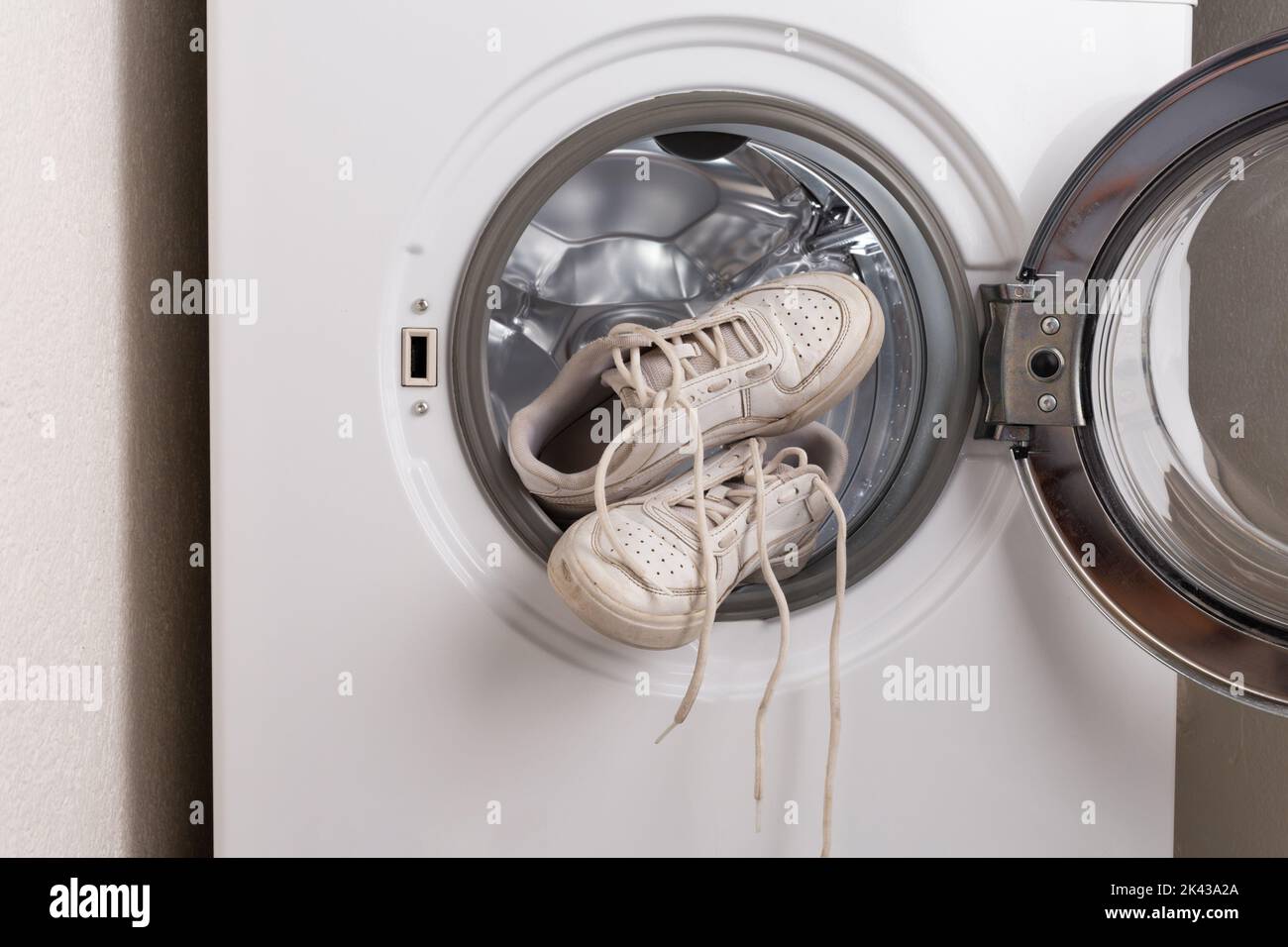 dirty white sneakers wash in the washer, cleaning sporty shoes at home