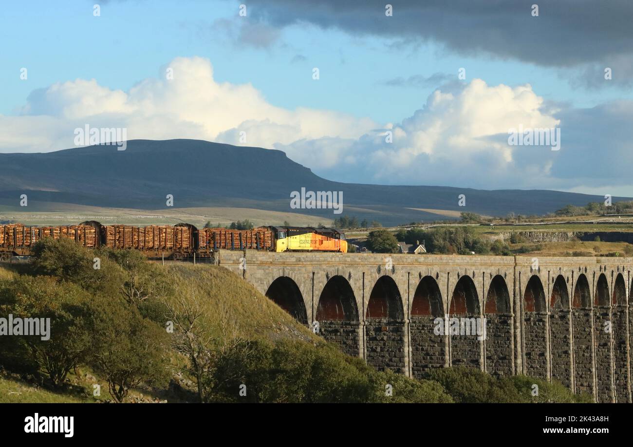 Colas rail freight class 70 diesel-electric locomotive, number 70803, on Ribblehead Viaduct on Settle to Carlisle railway line on 27th September 2022. Stock Photo