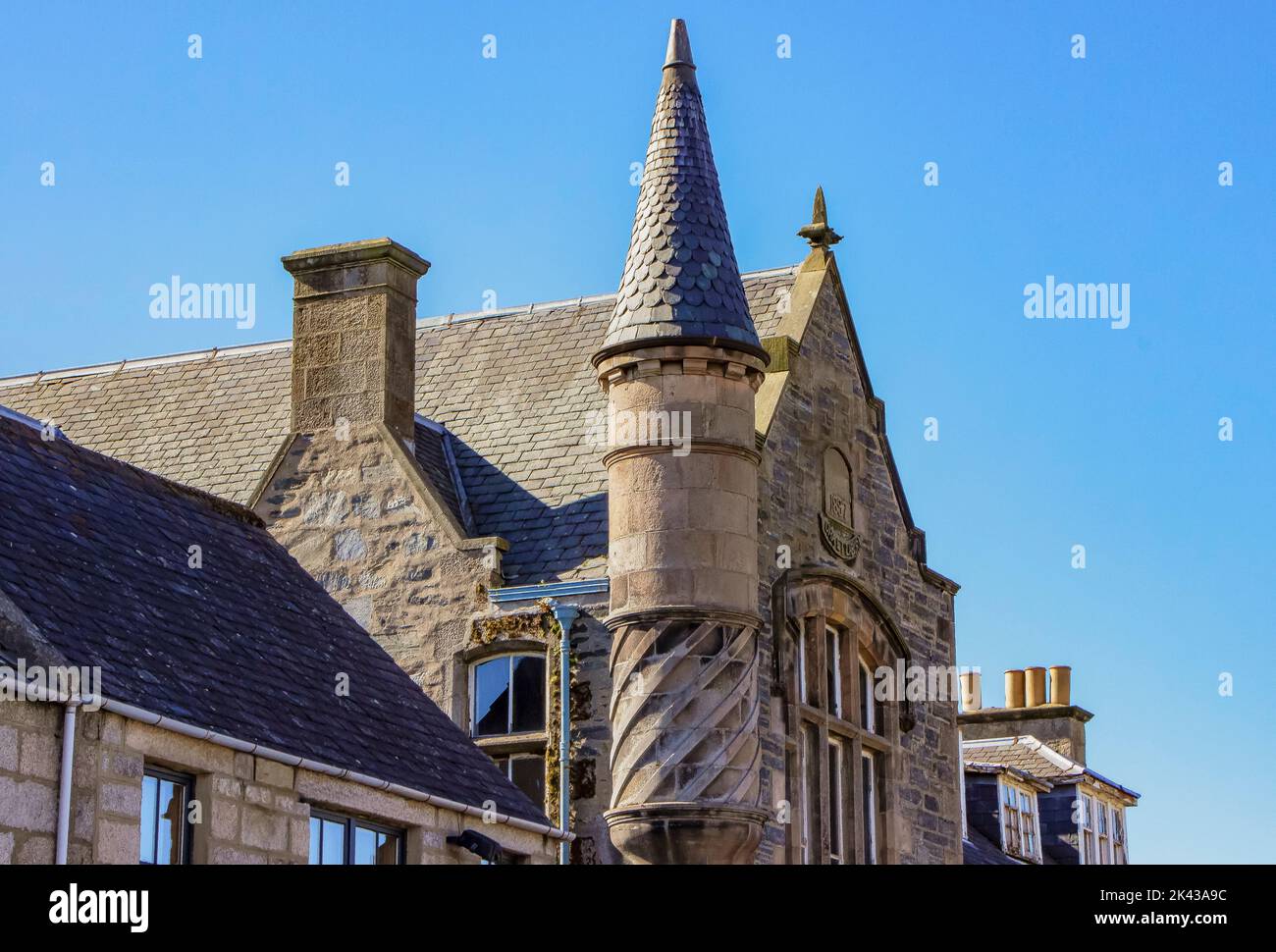 Stone building with a round tower and spiral made of stone Stock Photo