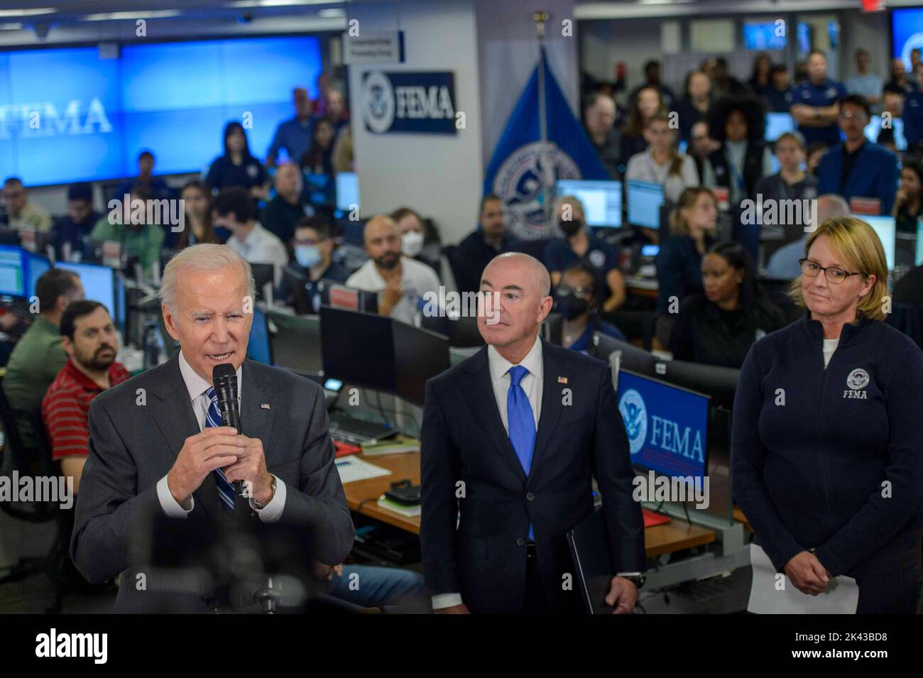 United States President Joe BIden speaks as United States Secretary of Homeland Security Alejandro Mayorkas and Deanne Criswell, Administrator, Federal Emergency Management Agency (FEMA) look on during a press conference after being briefed on the impact of Hurricane Ian and ongoing federal government response efforts at the FEMA Headquarters in Washington, DC on Thursday, September 29, 2022. Credit: Bonnie Cash/Pool via CNP Stock Photo