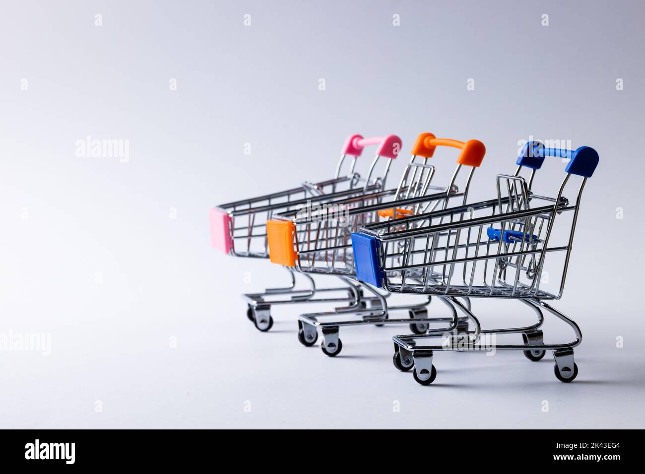 Composition of shopping carts and copy space on white background Stock ...