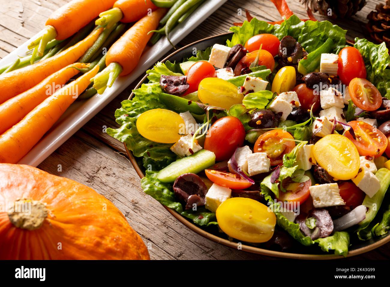 Close up of thanksgiving vegetables with autumn decoration on wood Stock Photo