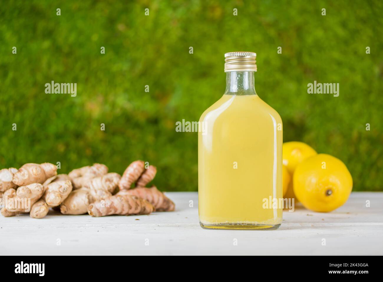 Fresh homemade ginger shot drink for immunity boosting during cold