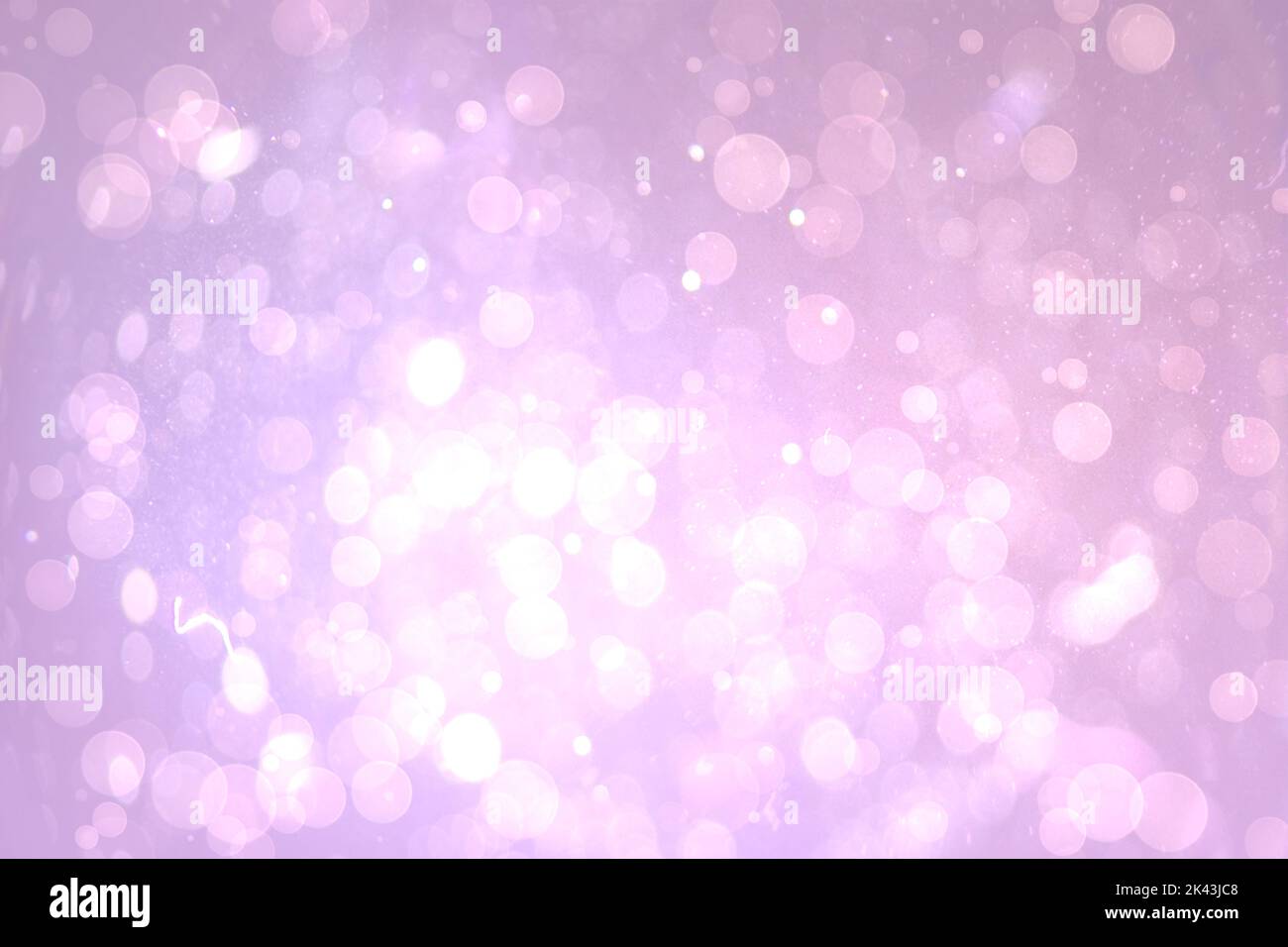 Abstract illustration of bokeh spots of light against purple background ...