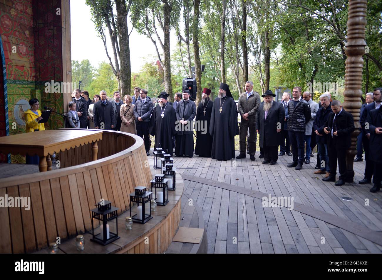 KYIV, UKRAINE - SEPTEMBER 29, 2022 - Participants of a joint interreligious prayer dedicated to the Day of Remembrance of the Babyn Yar Victims are seen at the symbolic Place for Reflection synagogue on the territory of the Babyn Yar National Historical and Memorial Reserve, Kyiv, capital of Ukraine. Stock Photo