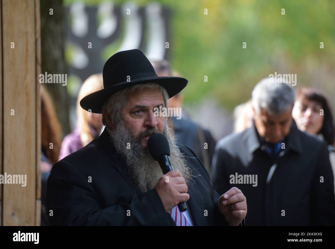 KYIV, UKRAINE - SEPTEMBER 29, 2022 - Chief Rabbi of Ukraine Moshe Reuven Asman speaks during a joint interreligious prayer dedicated to the Day of Remembrance of the Babyn Yar Victims at the symbolic Place for Reflection synagogue on the territory of the Babyn Yar National Historical and Memorial Reserve, Kyiv, capital of Ukraine. Stock Photo