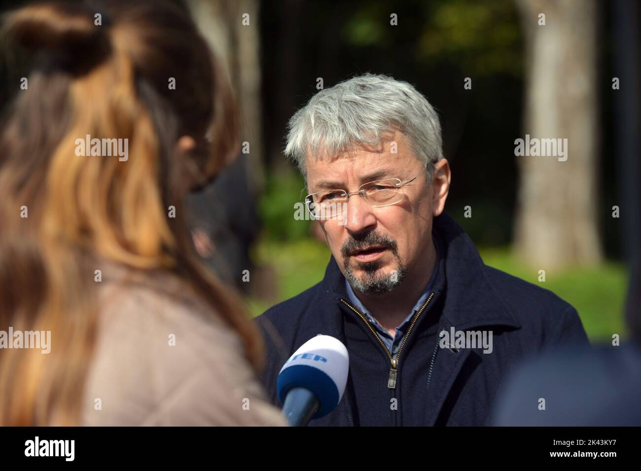 KYIV, UKRAINE - SEPTEMBER 29, 2022 - Minister of Culture and Information Policy of Ukraine Oleksandr Tkachenko speaks with journalists after a joint interreligious prayer dedicated to the Day of Remembrance of the Babyn Yar Victims at the symbolic Place for Reflection synagogue on the territory of the Babyn Yar National Historical and Memorial Reserve, Kyiv, capital of Ukraine. Stock Photo