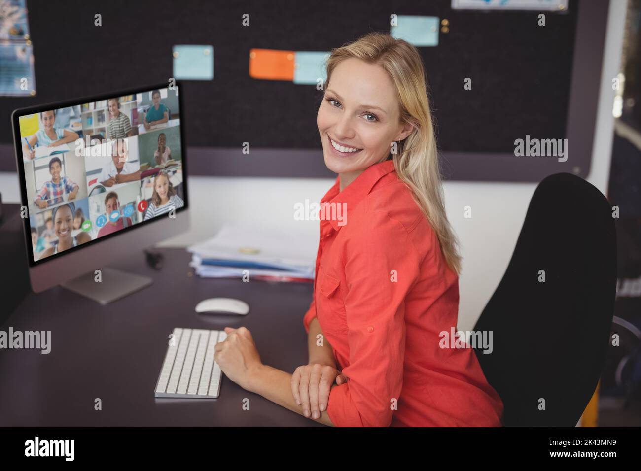Portrait of female teacher having a video conference with multiple ...