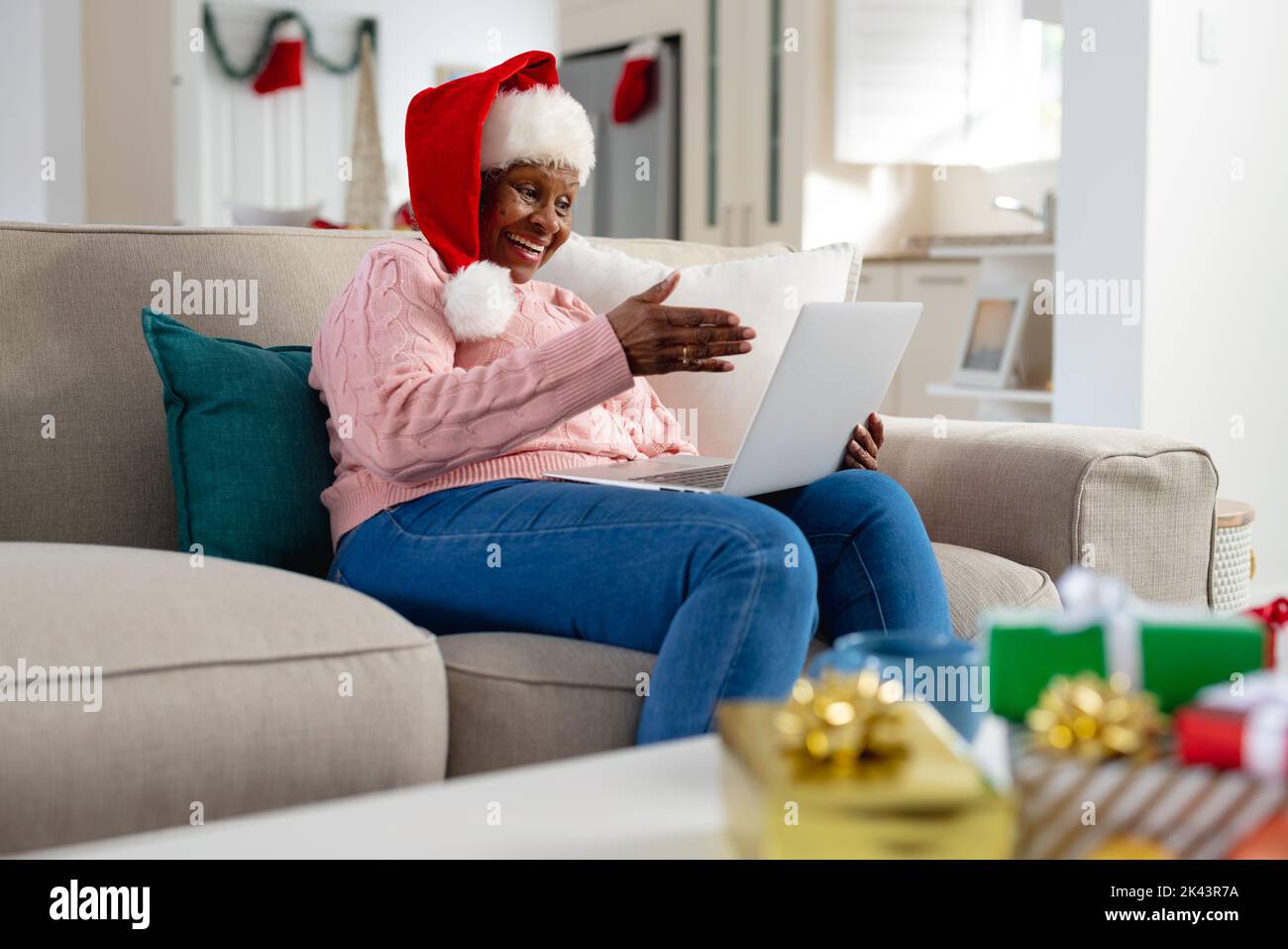 Thoughtful senior african american women wearing santa claus hat and ...