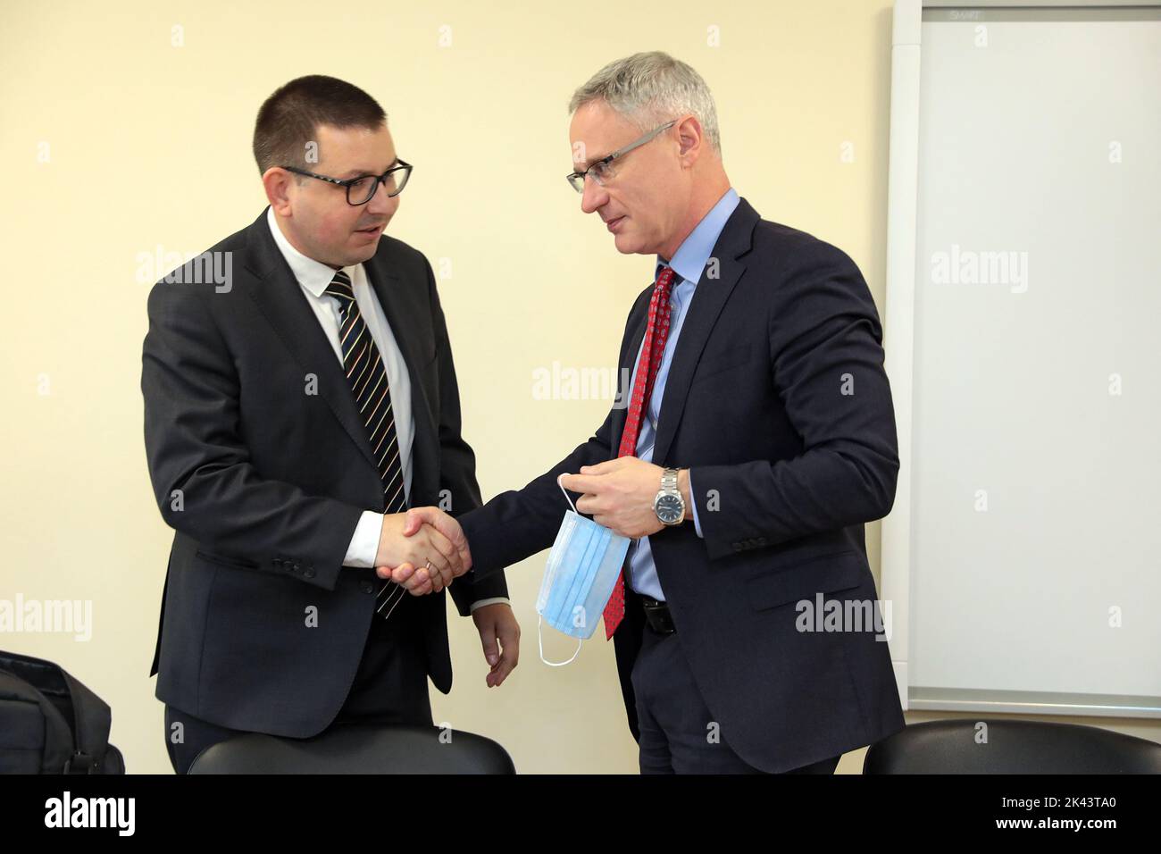 KYIV, UKRAINE - SEPTEMBER 28, 2022 - Ambassador Extraordinary and Plenipotentiary of the State of Israel to Ukraine Michael Brodsky (R) and Director of Kyiv City Children's Clinical Hospital no.2 Andrii Perevezentsev shake hands during the ceremony of handing over medical equipment from the Embassy of Israel to Ukraine to Kyiv City Children's Clinical Hospital no.2, Kyiv, capital of Ukraine. Stock Photo