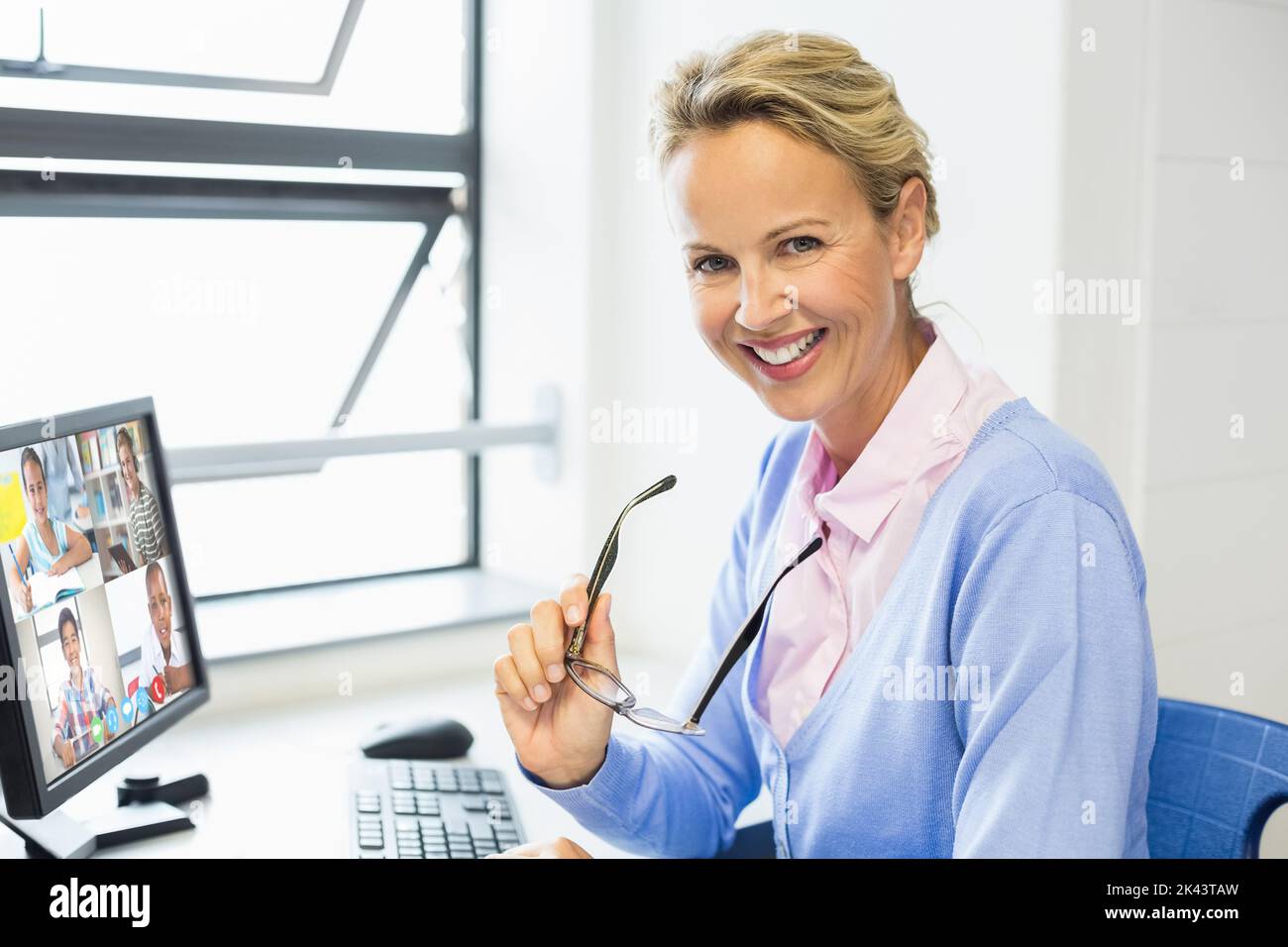 Portrait of female caucasian teacher having a video conference with ...