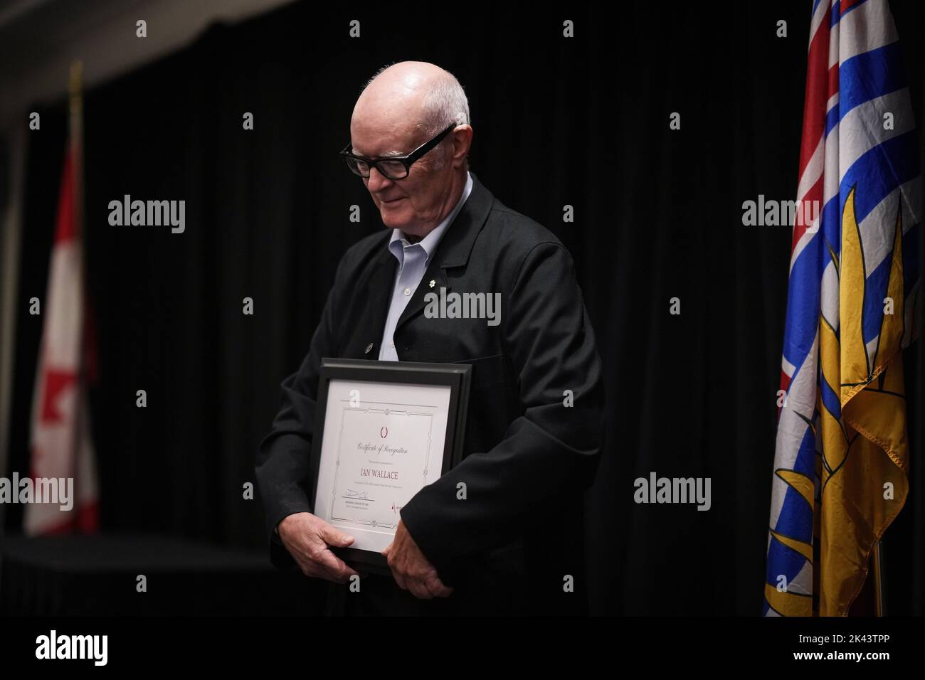 Artist Ian Wallace holds a certificate of recognition after being awarded  the $100,000 Audain Prize for Visual Art, in Vancouver, B.C., Thursday,  Sept. 29, 2022. The Audain Prize, was established in 2004