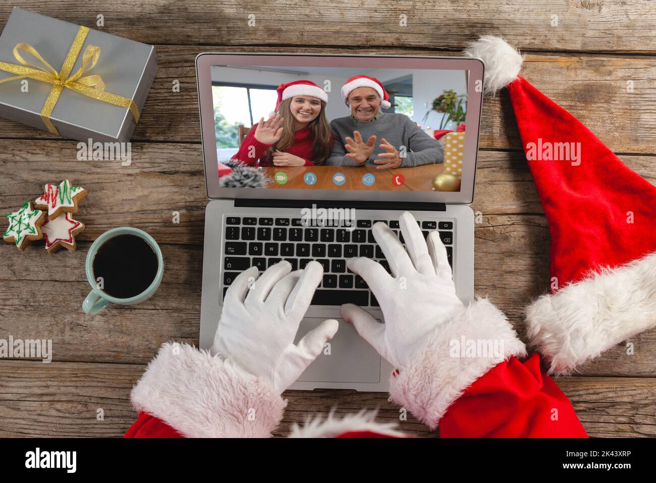 Santa claus making laptop christmas video call with waving caucasian ...