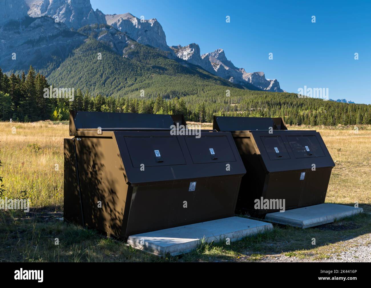 Animal proof garbage dumpsters in a park in Canmore, Alberta, Canada on a sunny day Stock Photo