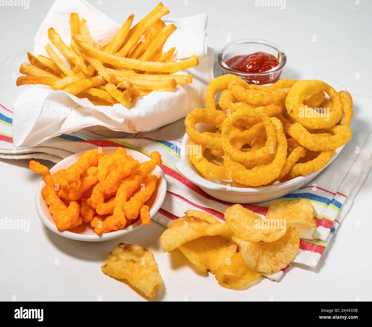 Assorted fattening processed foods on tablecloth Stock Photo