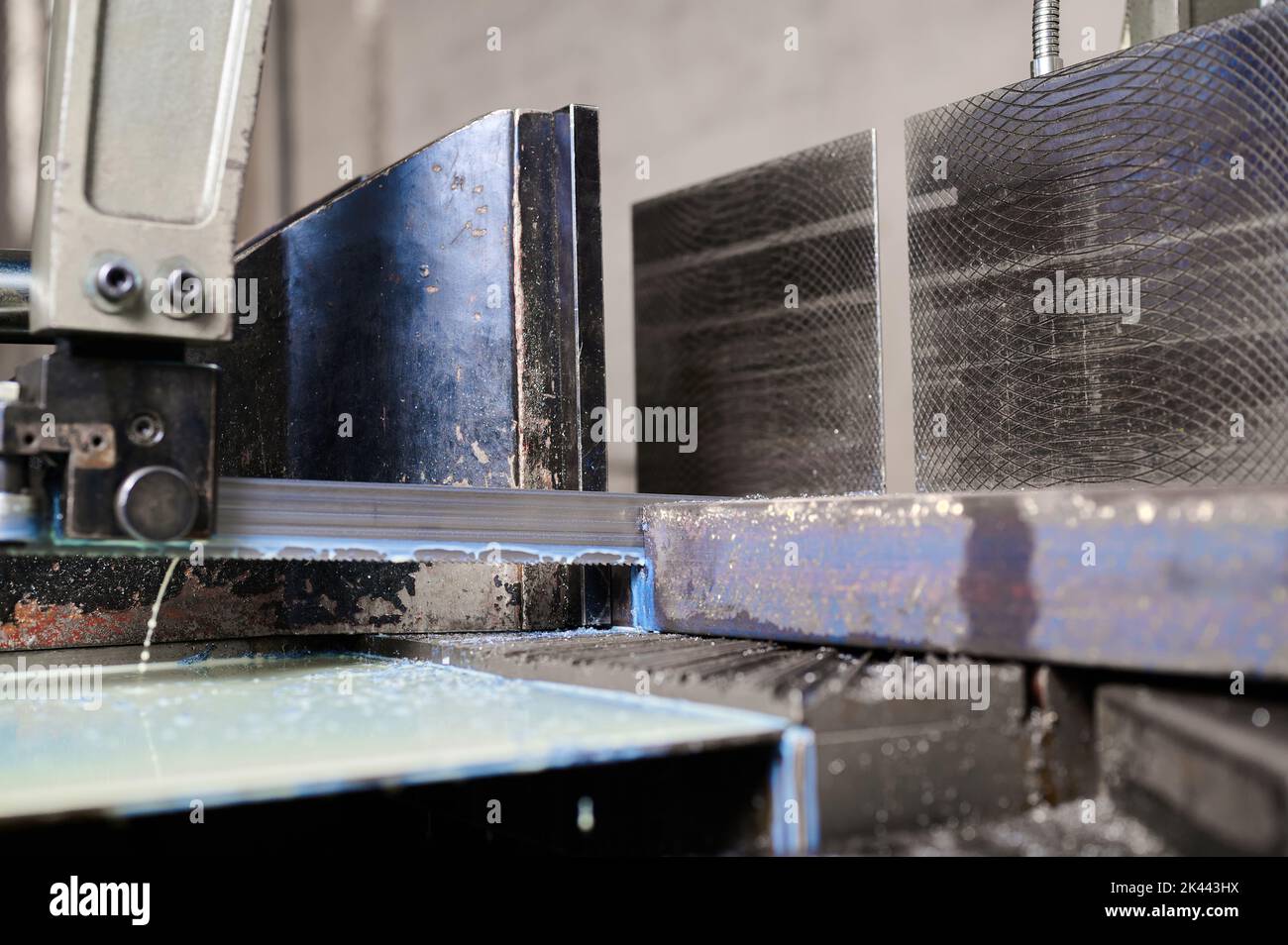 Cutting metal beam with band saw in plant Stock Photo Alamy