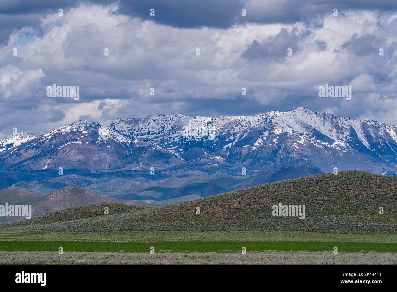 Usa, Idaho, Fairfield, Dramatic clouds over snowcapped Soldier Mountain Stock Photo