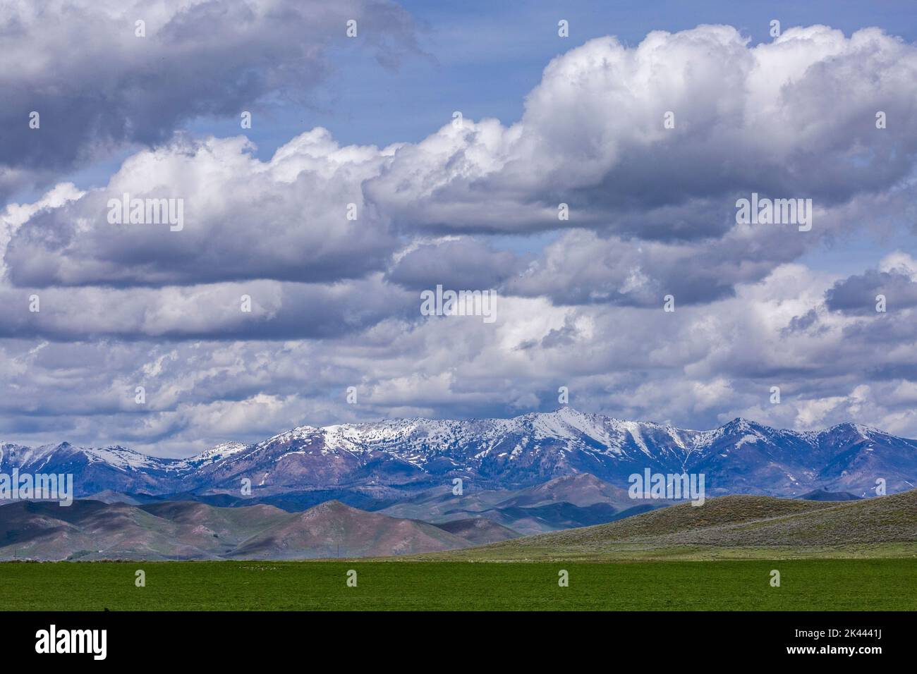 Usa, Idaho, Fairfield, Dramatic clouds over snowcapped Soldier Mountain Stock Photo