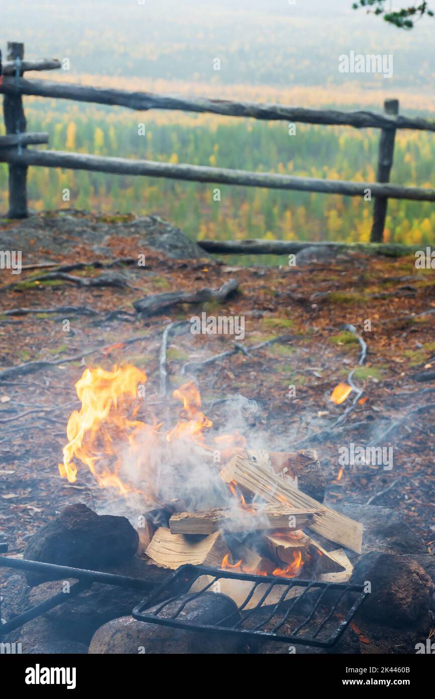 Campfire on top of Pallistajavaara fell in drizzly weather in Pello Finland Stock Photo