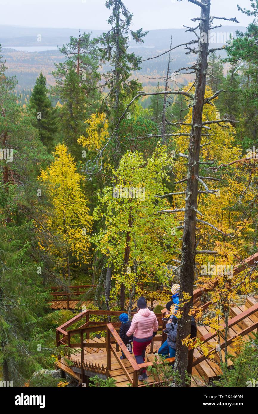 People going down at the wooden stairs from Pallistajavaara in Pello Lapland Stock Photo