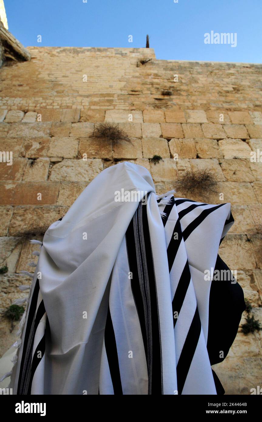 Jewish men praying by the Wailing Wall / Western Wall in the Jewish quarter in the old city of Jerusalem, Israel. Stock Photo