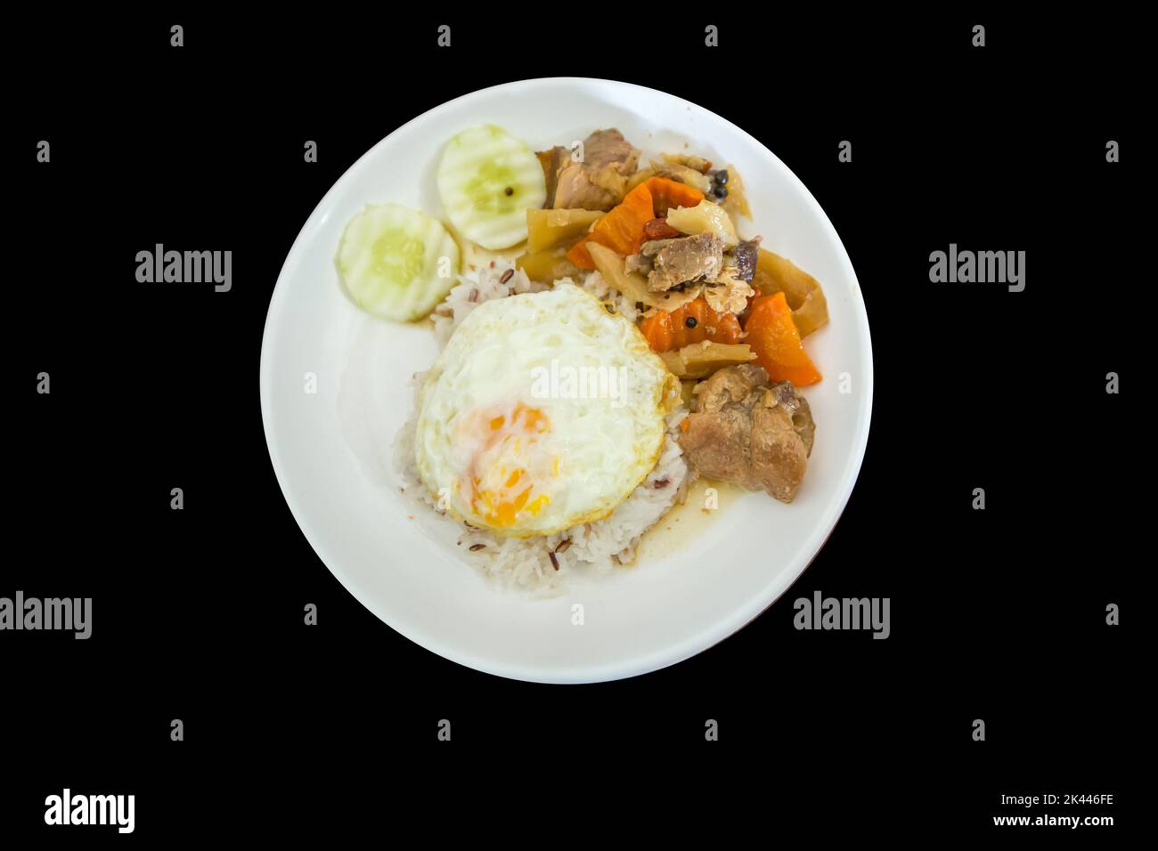 Die cut of Braised Pork Over Rice and Fried egg on black isolated Stock