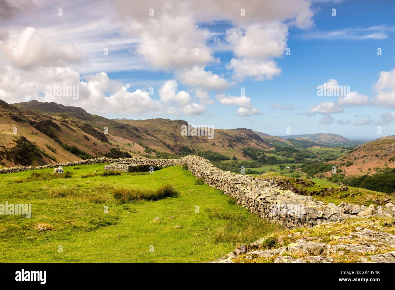 19 May 2022: Hardknott Pass, Cumbria, UK - Remains of Hardknott Roman Fort on a bright spring day, with a view of Eskdale. Stock Photo