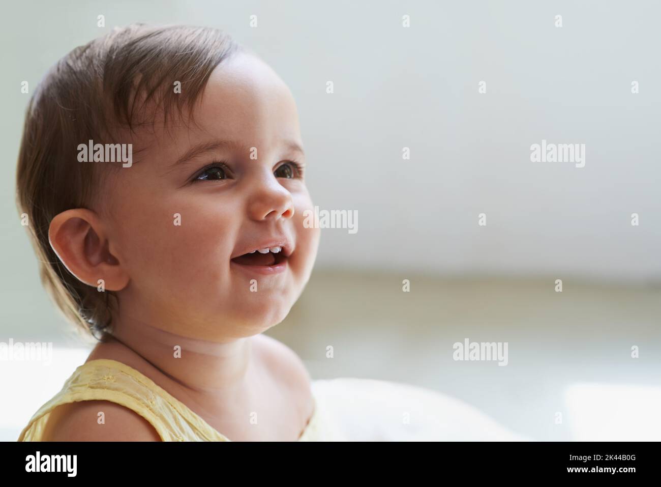 Babies dont get any cuter than this. an adorable little baby sitting on