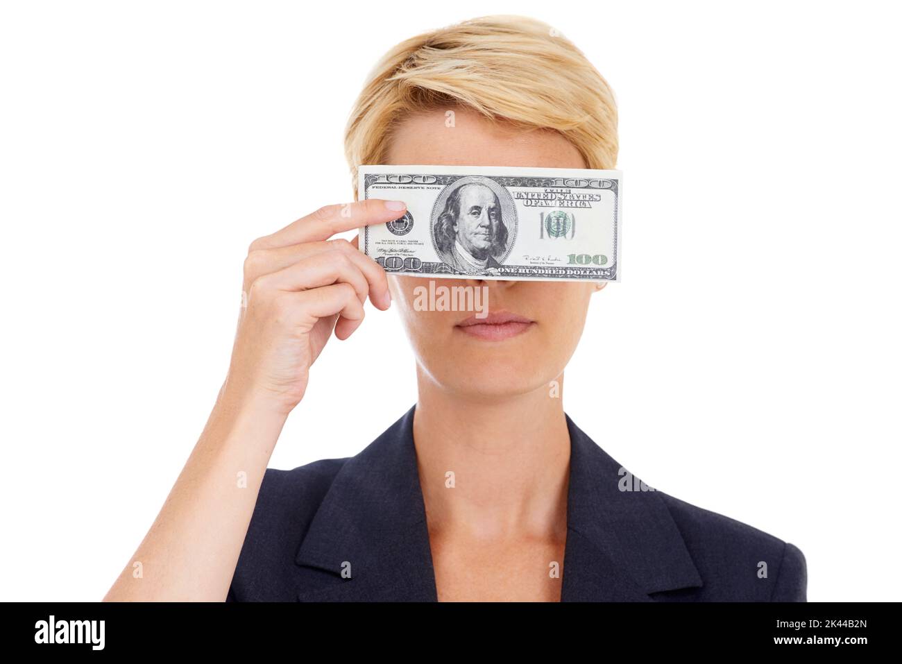 Money conceals everything. A young businesswoman holding a 100 dollar bill in front of her eyes. Stock Photo