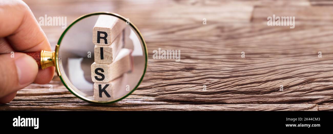Strategic Risk Control And Magnifying Glass Concept Stock Photo