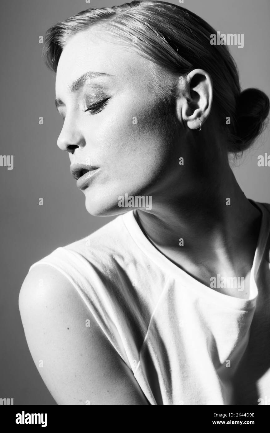 Classic beauty. Black and white image of a beautiful woman posing in casual wear. Stock Photo